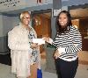 Christy Bobo (right), Housing Director at COSA, presents raffle winner Yvette Cauthorn (left), of Chester a voucher to be used for home heating oil this winter.