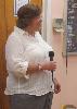 Kim McDaniel, Schoolhouse Center Director, welcomes attendees to dinner on the final night of the Caregiver Academy. 