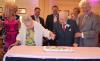 Marion Roth, 106, and Fred J. Mack Jr., 104, cut the centenarian birthday cake. 