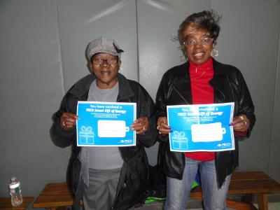 Doris Burgess (left), of Lansdowne, and Betty Whitehead (right) of Drexel Hill, display their raffle prizes- $125 PECO vouchers to be used toward utility payment.