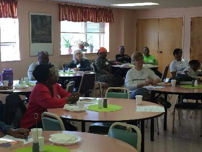 Caregivers listen to Dr. Barry Jacobs discuss Non Traditional Caregiving.