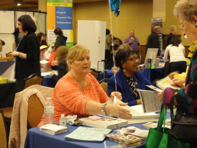 Annie McAlpin, of COSA, gets ready to stamp a guest's Bingo card. 