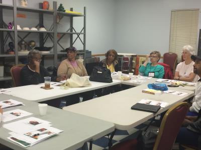 Caregivers Grace Brown-Johnson, Vanessa Sanders, Diane Thompson, Maria Marinakis, Cheryl Macklin, and Truluck Christopher Legette listen to presenter, Tom Carroll.