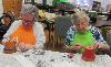 Care receivers participate in a horticulture activity.