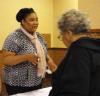 Sharisse Stanford, COSA's Housing Director, visits with guests