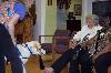 Facility dog, Archie, demonstrates a tug by pulling off Eleanor Miller's sock.