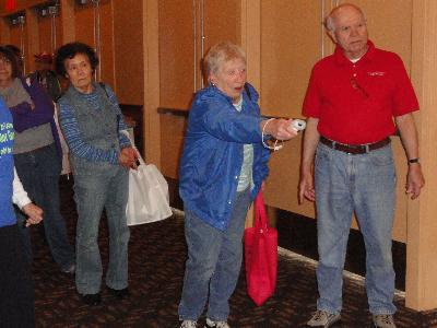 Giving Wii Bowling a try at the Senior Games table. Wii Bowling is one of the games featured in the Delaware County Senior Games.