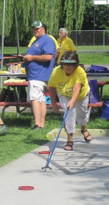 Barbara Lenzi, 68, of Media competes in Shuffleboard.