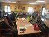 Bill Jones, Anna Garvins, Walter Brown, and Gloria Thompson participate in a memory card game with presenters, Paula and Carole on the left. 