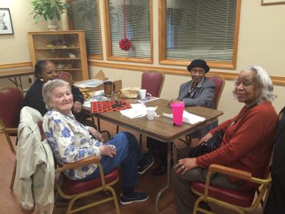 Penny Marinakis; Chester Senior Center Program Coordinator, Vicky; Bernice Sanders; and Gloria Thompson participate in storytelling and reminiscing. 