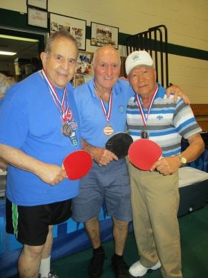 Table Tennis medalists: Alan Kutner, Dave Hirst, and Esteban Abarintos