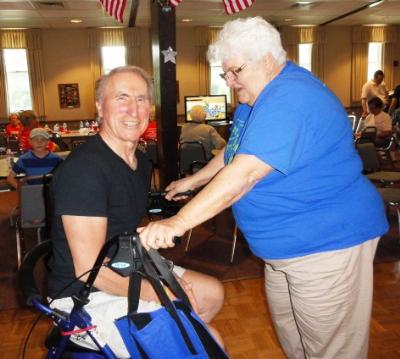 Joyce Boyle gives her friend, Tom Hasiuk, a lift.