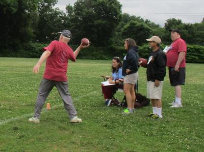 Ray Young Sr. tosses the football