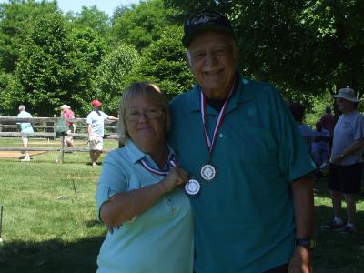Margaret DiLuzio and Dominick Travaglini show off their medals.
