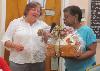 Kim McDaniel, Director of Schoolhouse Center, chooses a raffle winner at the dinner on the final night of the Caregiver Academy. 