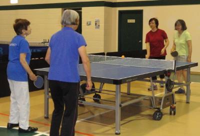 Tatiana Ivauova, Ying Wu, Lucyle Pollock and Yuping Huang compete in Women's Doubles Table Tennis.