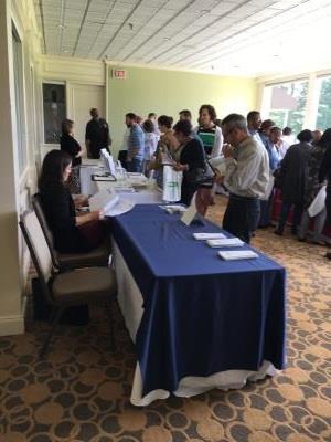 Resource room at the Housing Symposium with tables from COSA, Legal Aid of Southeastern PA, Community Action Agency of Delaware County among others