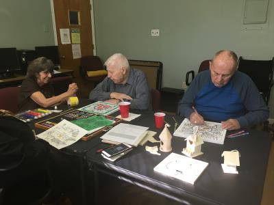 Care receivers participate in a brain stimulating exercise.	