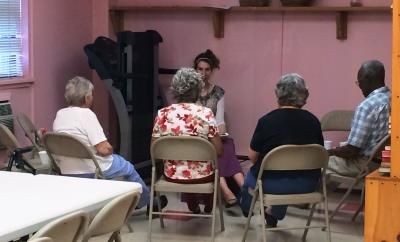 Care receivers participate in a fitness activity with Frannie Schmerling, Certified Recreational Therapist with Senior Center at Home.