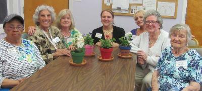 Care receivers participate in a horticulture activity.